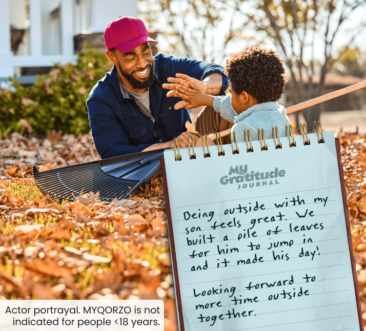 Man and young boy playing outside; My Gratitude Journal with the following entry: Being outside with my son feels great. We built a pile of leaves for him to jump in and it made his day! Looking forward to more time outside together.