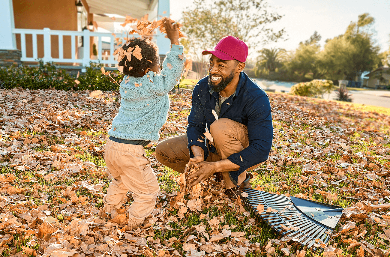 Man and young boy playing outside
