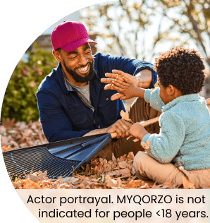 Man and young boy playing outside