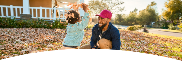 Man and young boy playing outside