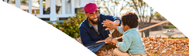 Man and young boy playing outside
