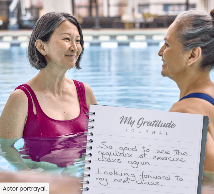 Two women talking in a swimming pool; My Gratitude Journal with the following entry: So good to see the regulars at exercise class again. Looking forward to my next class.